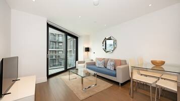 Family Apartment, 2 Bedrooms, Garden View | Living area | Flat-screen TV, heated floors