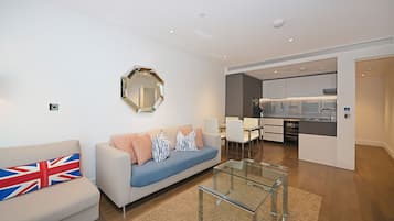 Family Apartment, 2 Bedrooms, Garden View | Living area | Flat-screen TV, heated floors