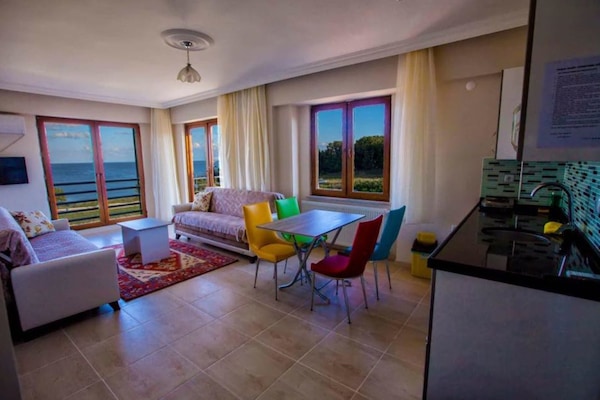 Apartment, Sea View | Living area | LCD TV