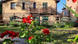 A two-story building with a stone base and a beige upper section. - Agriturismo di Sordiglio (Casina)