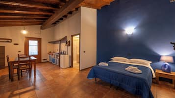 Premium bedding, desk, laptop workspace, blackout drapes