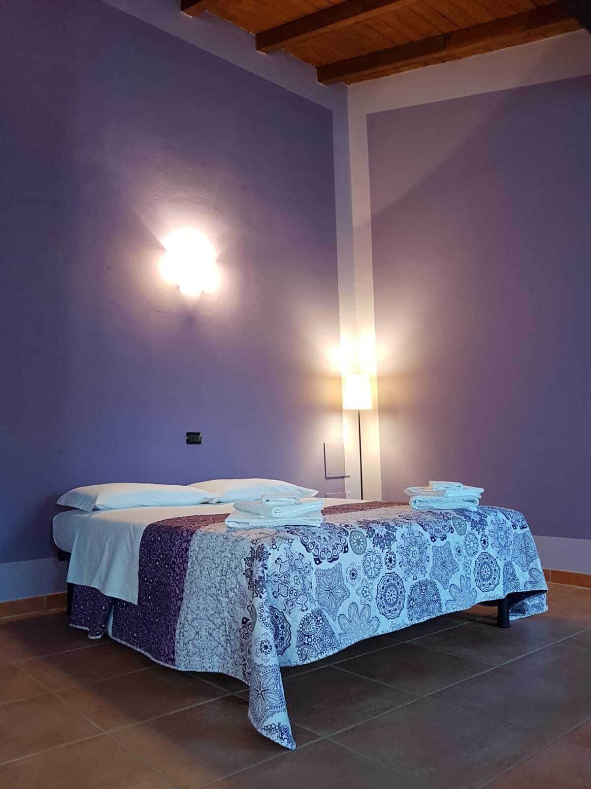 Premium bedding, desk, laptop workspace, blackout drapes