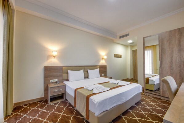 Ropa de cama de alta calidad y minibar 