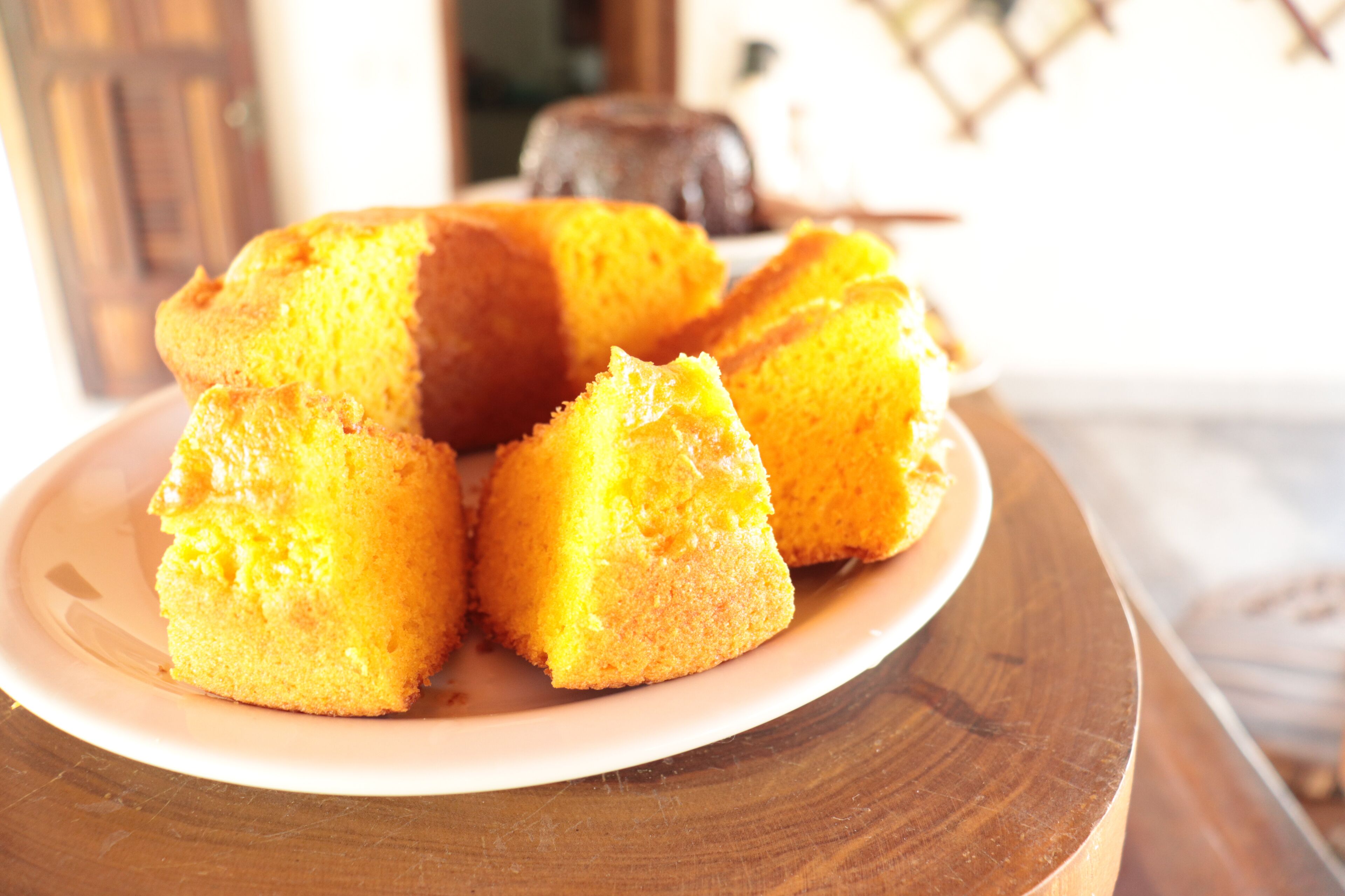 A plate of cornbread on a wooden table.