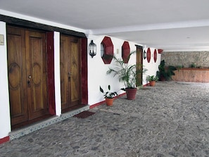 Traditional architecture meets lush greenery in this charming exterior.