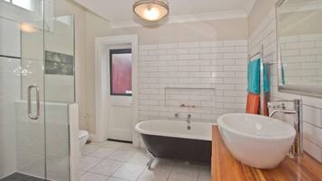Bathtub, hair dryer, towels, soap