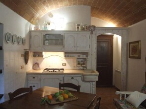 Enjoy cooking in this well-equipped kitchen with a stove and sink.
