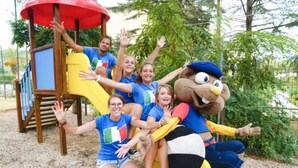 A group of people at a playground with a mascot. - Studio - Studio Apartment, Sleeps 4 (Porto Azzurro)