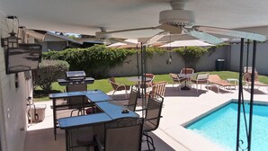 An outdoor patio with a pool, a grill, and outdoor furniture. - Pool House - 3-bdrm, 2 bath, Heated Pool, Walk to Asu (Tempe)