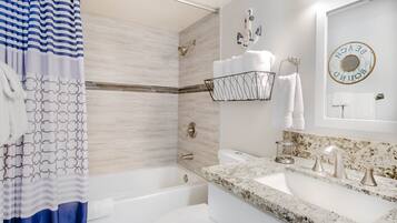 Combined shower/bathtub, hair dryer, towels, soap