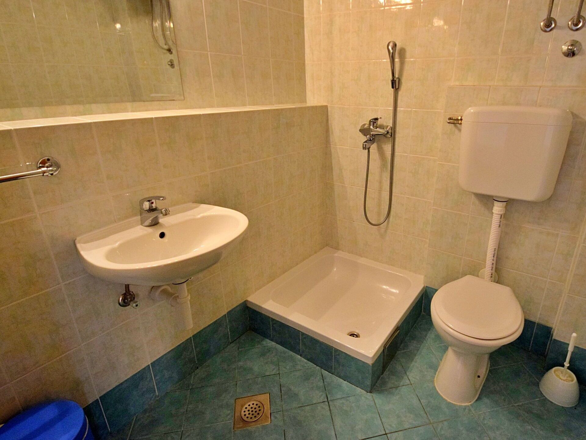 A bathroom with a sink, a bathtub, and a toilet.