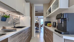 A modern kitchen with a stainless steel sink, a built-in oven, and a refrigerator. - Beautiful  villa for 6 guests with WIFI, A/C, private pool, TV, terrace and panoramic view (Pazin)