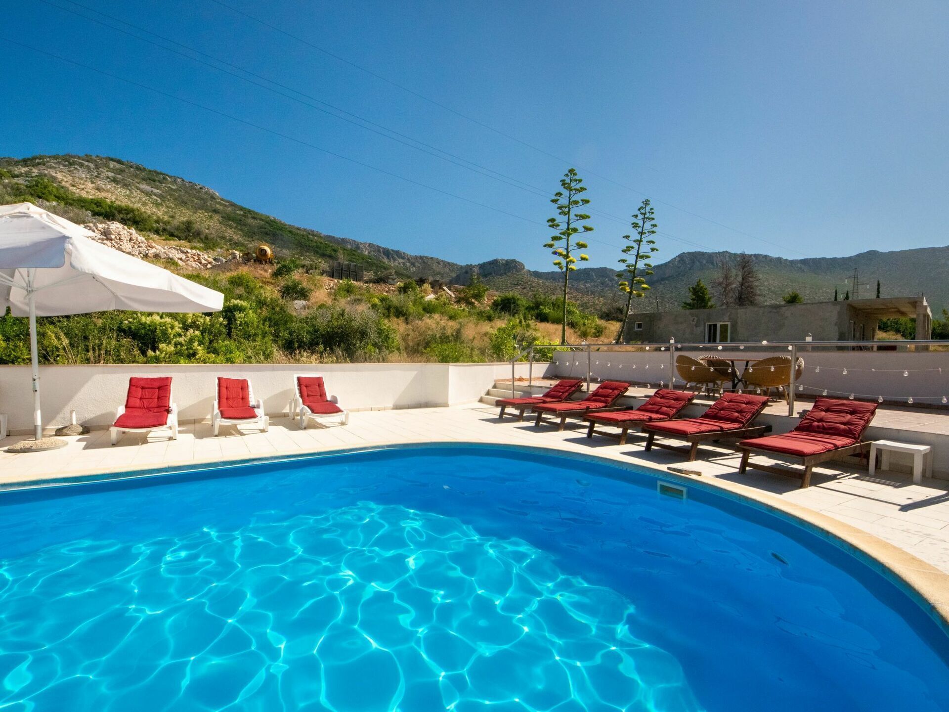 Water, Sky, Plant, Swimming Pool, Nature, Azure, Shade, Outdoor Furniture, Rectangle, Tree