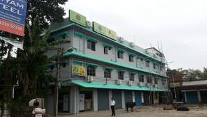 A multi-story building with signs for 'Hotel Gitanjali' and 'Food Court'. - Hotel Gitanjali Raiganj (Raiganj)