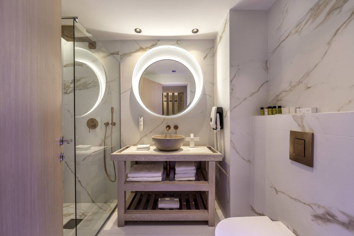premium suite, partial sea view | bathroom | eco-friendly toiletries, hair dryer, slippers, towels