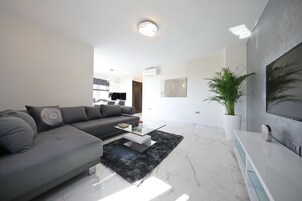 Design Two Bedroom Apartment with City View | Premium bedding, Tempur-Pedic beds, in-room safe, desk