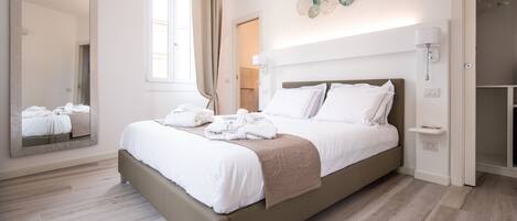 Premium bedding, down comforters, memory foam beds, minibar