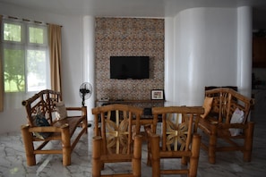 Premier House, 2 Bedrooms, Beach View, Beachfront | Living area | 32-inch LED TV with cable channels, TV