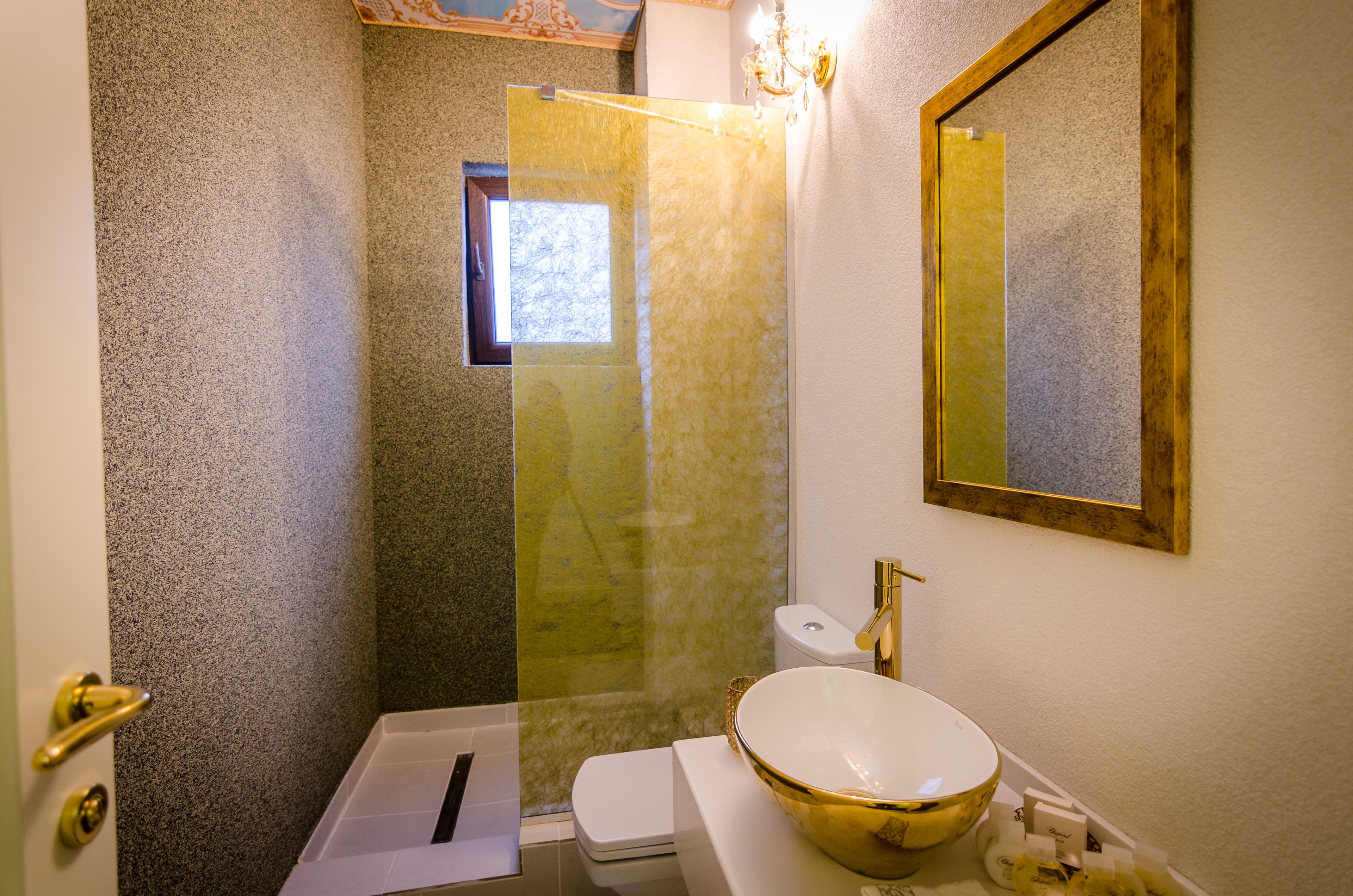 A bathroom with a bathtub, toilet, and sink.