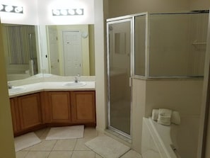 Combined shower/tub, hair dryer, towels, soap