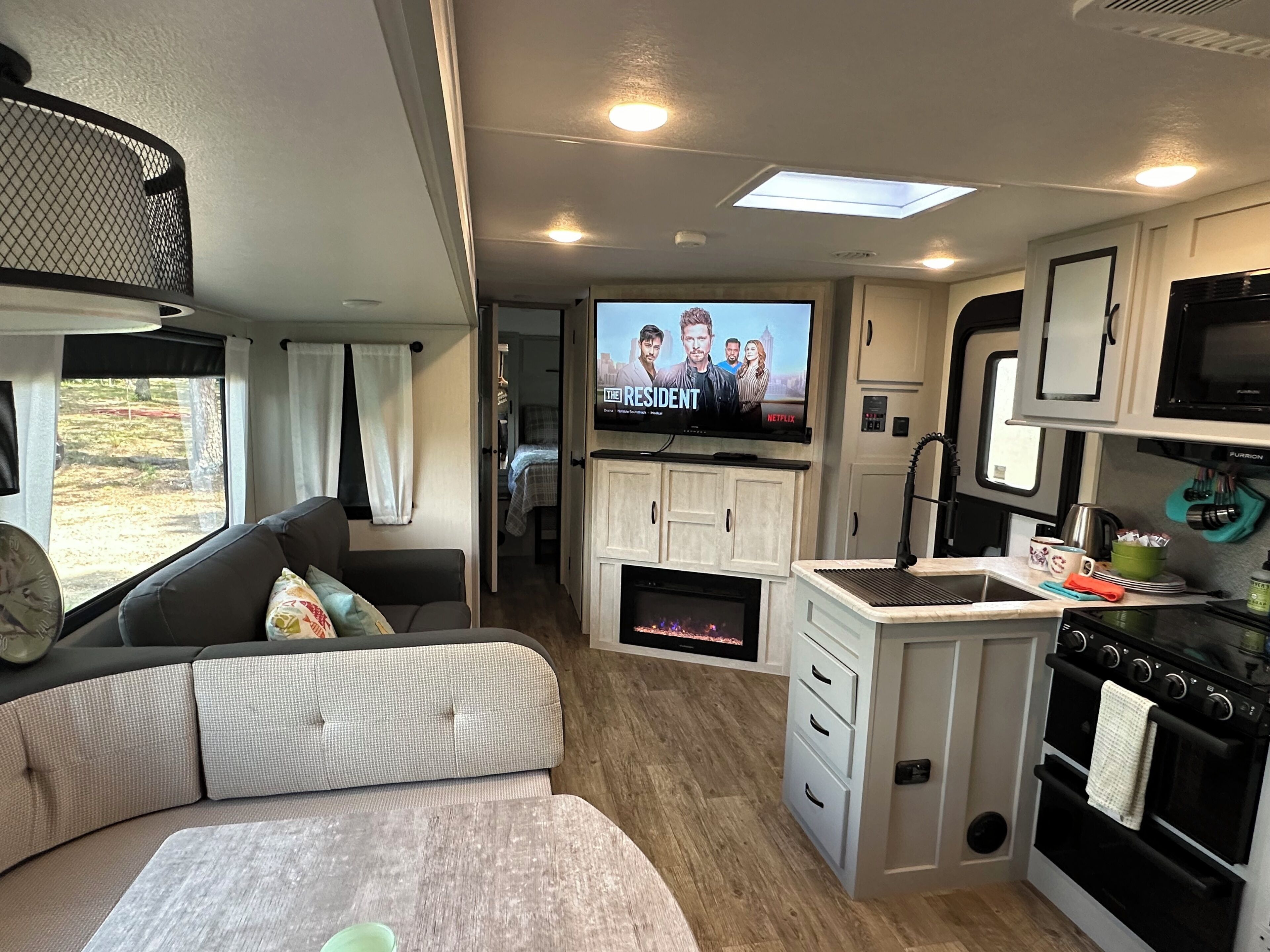 Smart TV, fireplace, books, printers