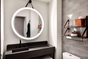 Shower, rainfall showerhead, designer toiletries, hair dryer at Moxy NYC Downtown