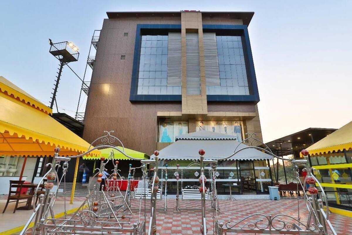 A modern building with a large glass facade and a central entrance.