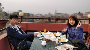 Breakfast, lunch, dinner served; local cuisine, garden views