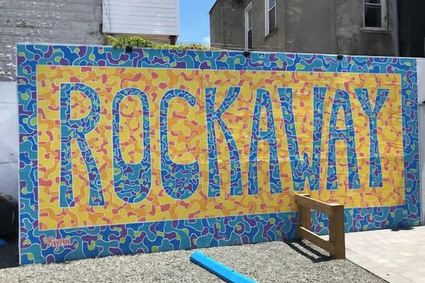 Iconic Rockaway mural adds local charm and beach-town character—perfect backdrop showcasing the neighborhood’s vibrant, creative spirit.