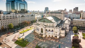 A historic building with a dome and classical architecture, surrounded by modern buildings and a busy square. - Mini-Hotel Kievskiy (Kyiv)