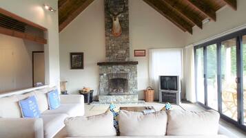House, 1 Bedroom, Lake View | Living area | Flat-screen TV, fireplace, DVD player