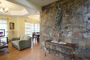 House, 5 Bedrooms | Living area | Flat-screen TV