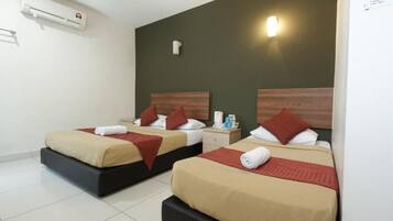 Family Deluxe Room | Desk, iron/ironing board, free WiFi, bed sheets