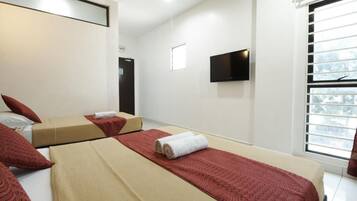 Family Deluxe Room | Desk, iron/ironing board, free WiFi, bed sheets