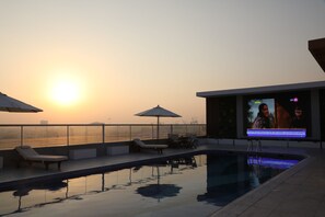 Indoor pool, outdoor pool, open 8 AM to 10 PM, pool loungers