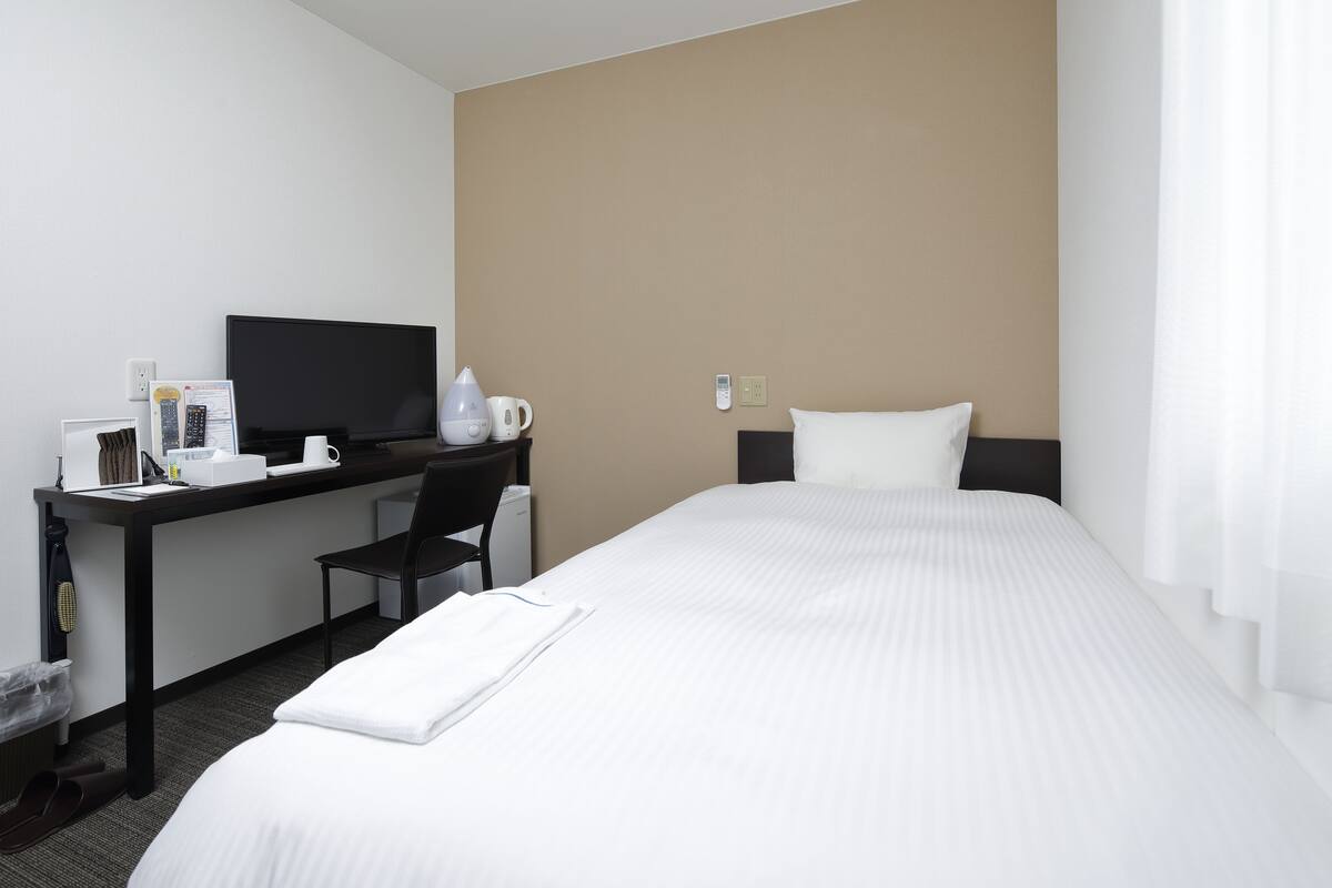 desk, laptop workspace, blackout curtains, iron/ironing board