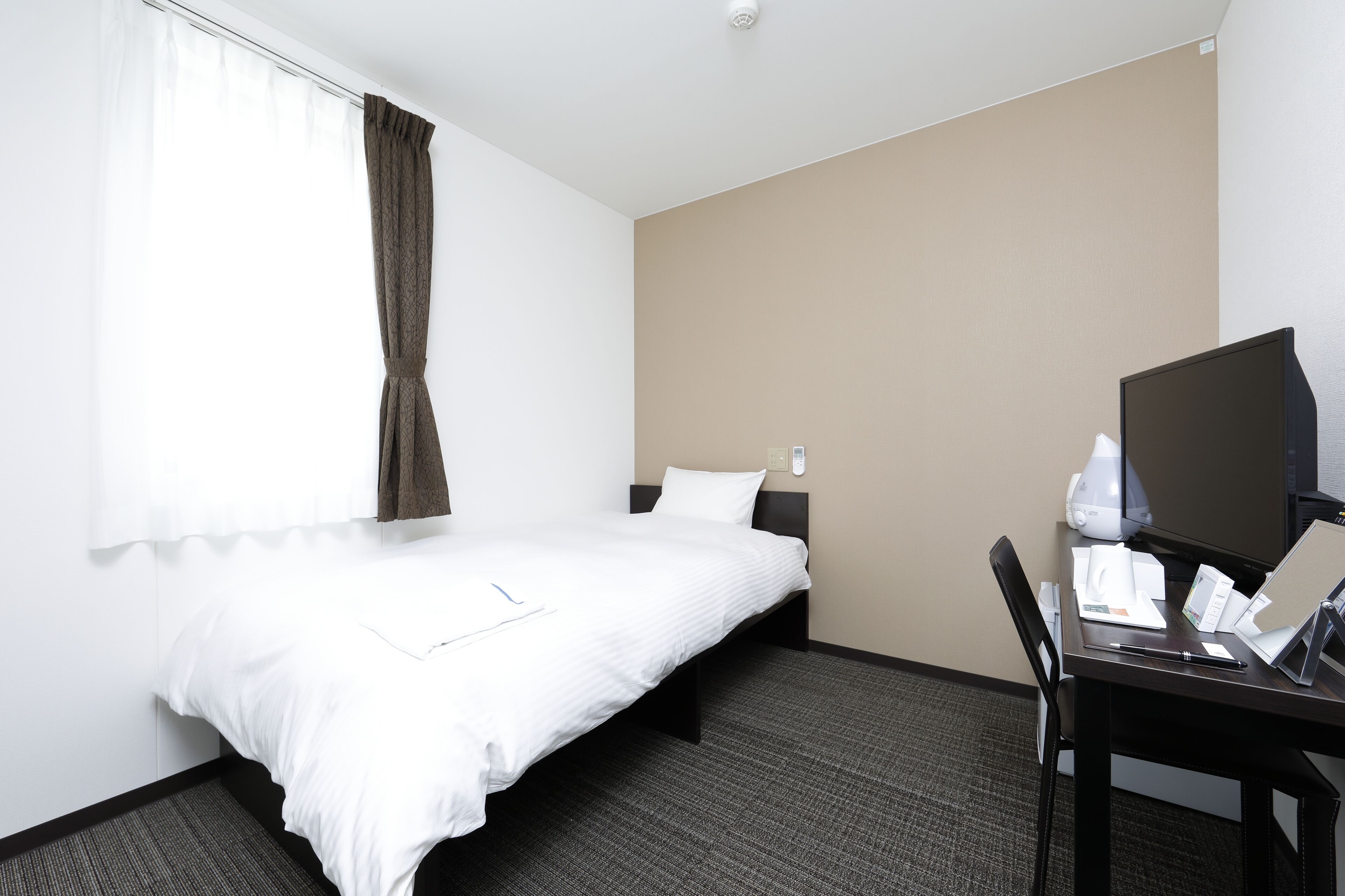 desk, laptop workspace, blackout curtains, iron/ironing board