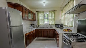 Villa, 4 Bedrooms, Garden View | Private kitchen | Coffee/tea maker, full-size fridge, microwave, oven