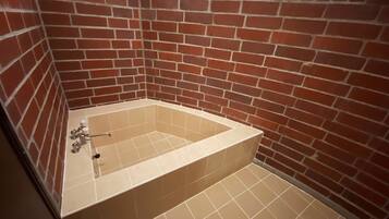 Separate tub and shower, deep soaking tub, eco-friendly toiletries