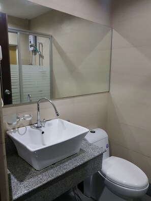 Shower, free toiletries, hair dryer, slippers