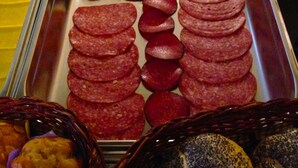 A buffet with various food items including sliced meats, pickles, and bread. - Hotel Rose (Ebersbach an der Fils)