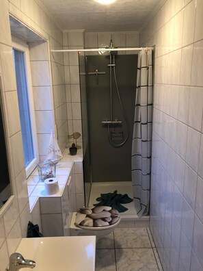 Separate tub and shower, hair dryer, towels, soap