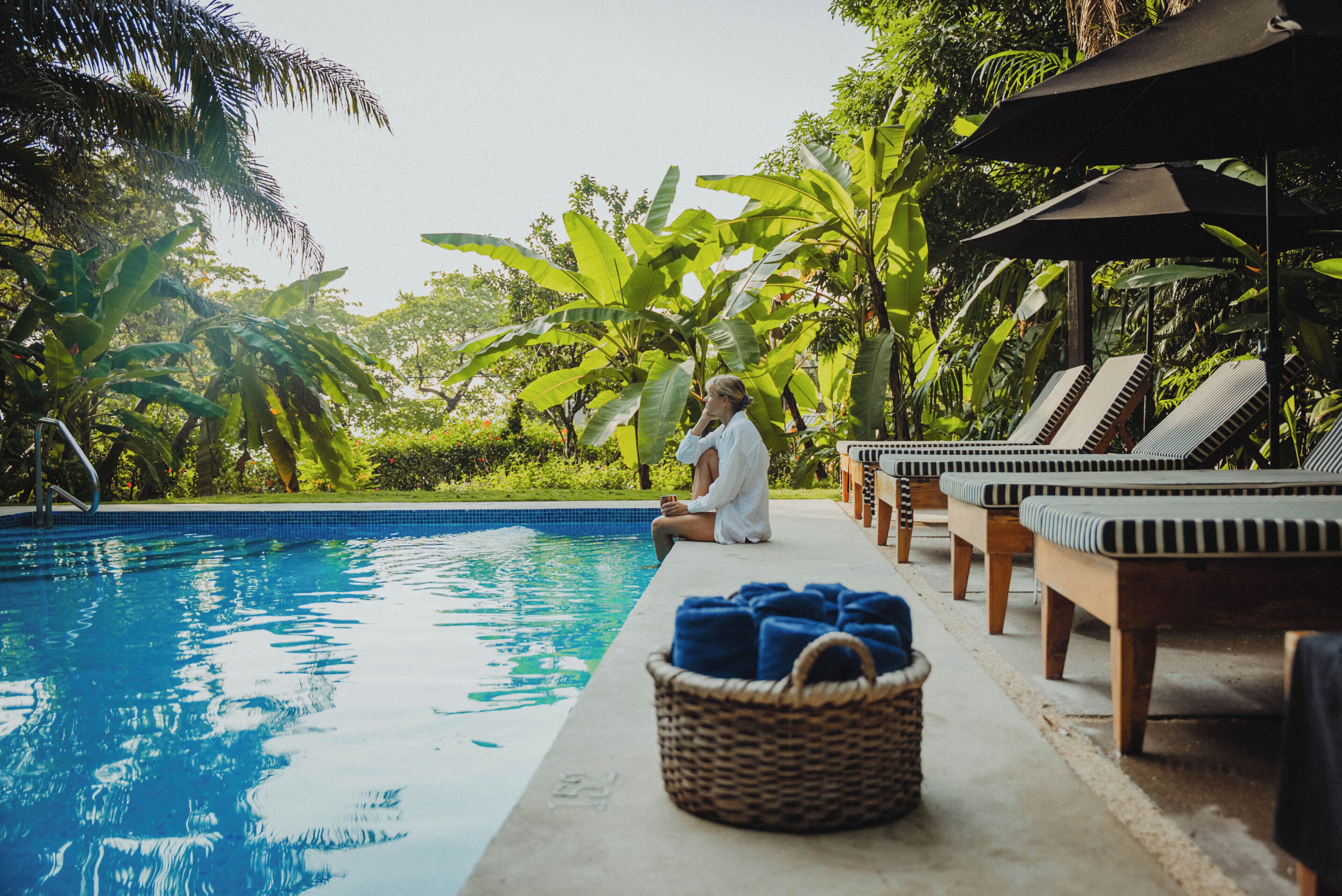 2 outdoor pools, open 7 AM to 10:00 PM, pool umbrellas, pool loungers