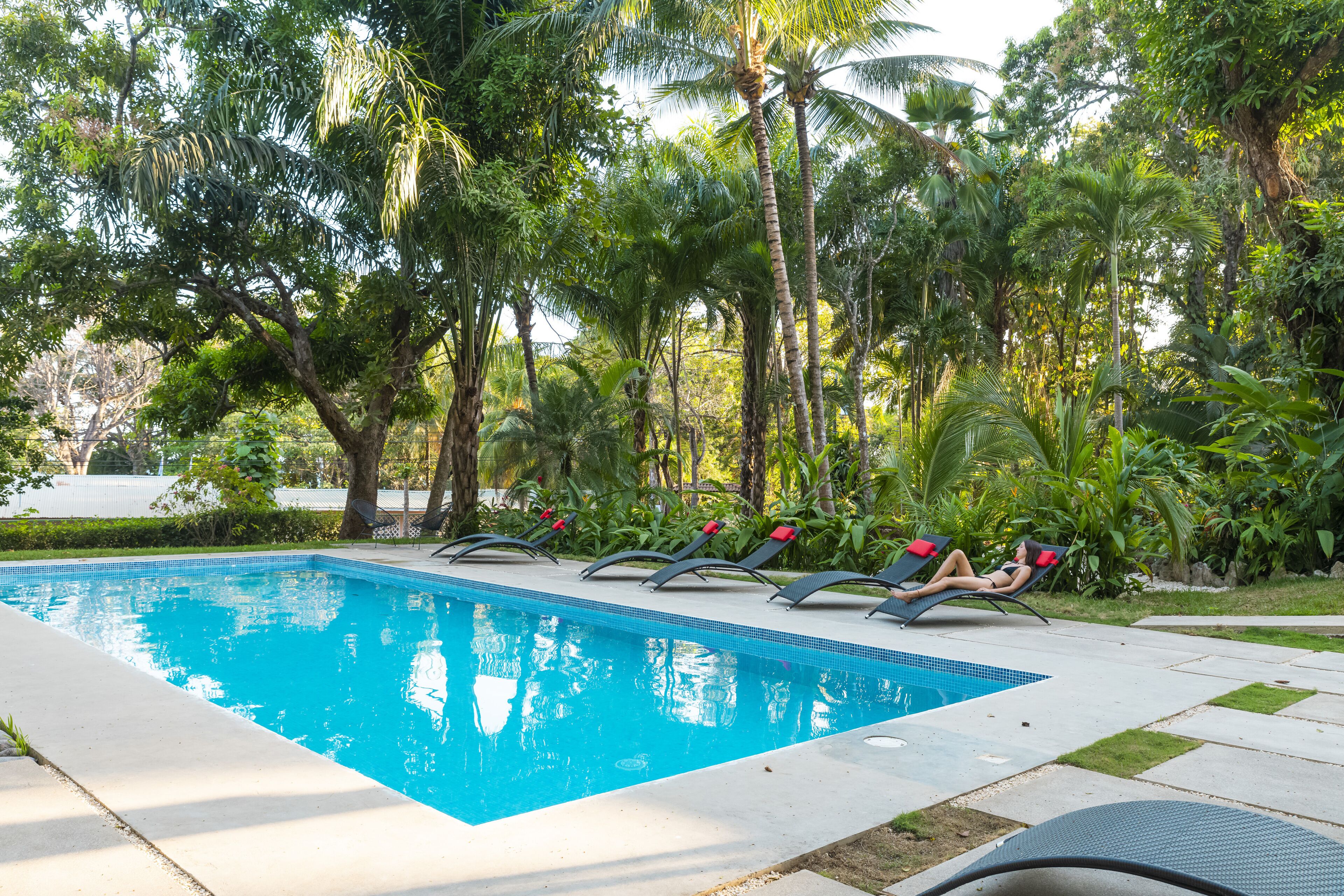 2 outdoor pools, open 7 am to 10:00 pm, pool umbrellas, pool loungers