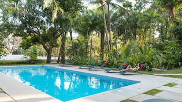 2 outdoor pools, open 7 AM to 10:00 PM, pool umbrellas, pool loungers