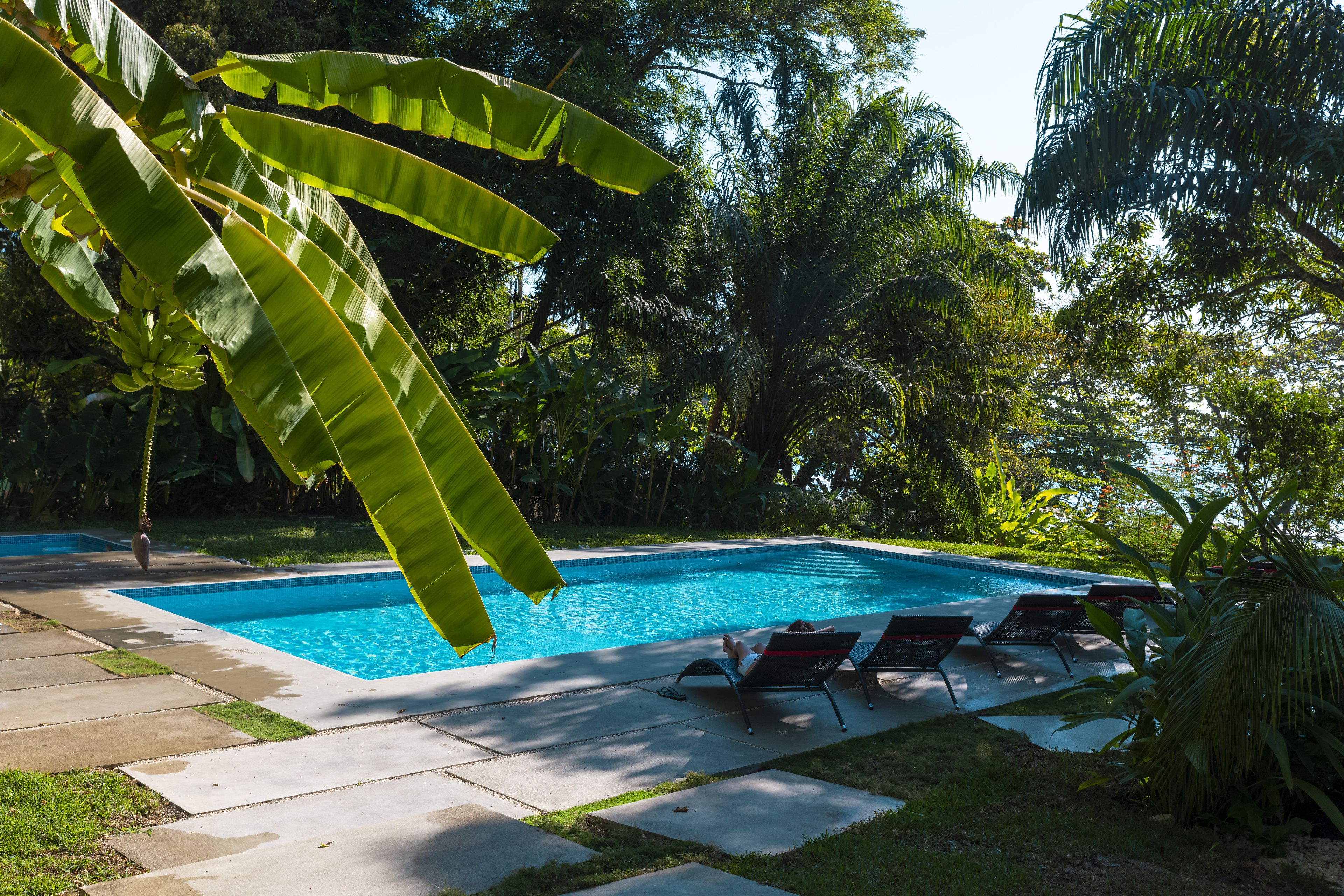 2 outdoor pools, open 7 am to 10:00 pm, pool umbrellas, pool loungers