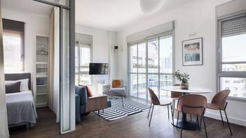 Exclusive Apartment, Multiple Beds | Living area | 39-inch flat-screen TV with digital channels, LED TV