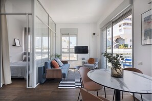 Appartement Exclusif, plusieurs lits | Coin séjour