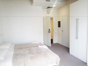 Quarto solteiro standard, 1 quarto | Frigobar, escrivaninha, Wi-Fi de cortesia, roupa de cama