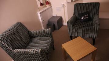Deluxe Double Room, 1 Bedroom | Living room | Flat-screen TV, DVD player